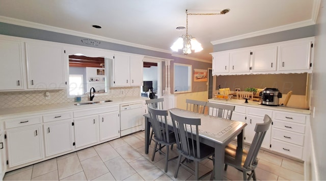 907 Cherry Ave, Dalhart, TX 79022 - kitchen featuring dishwasher, a sink, white cabinets, ornamental molding, and decorative backsplash
