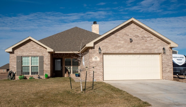 ranch-style home featuring driveway, a front yard, a garage, and brick siding