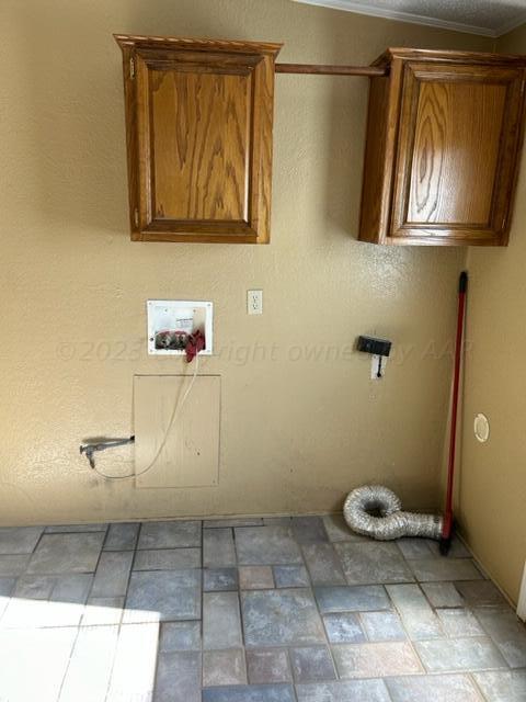 laundry room featuring cabinets, washer hookup, and ornamental molding