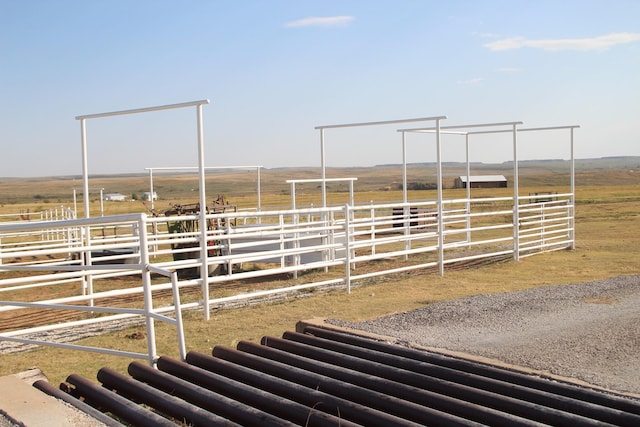 view of stable with a rural view