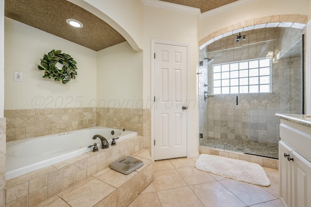 7826 Tarrytown Ave, Amarillo, TX 79121 - bathroom with crown molding, a garden tub, recessed lighting, tile patterned floors, and a stall shower
