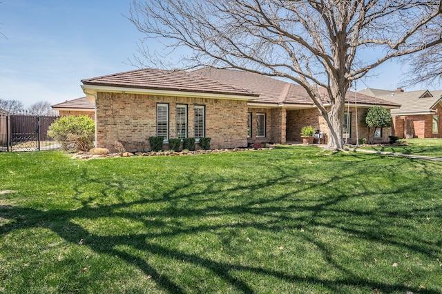 7826 Tarrytown Ave, Amarillo, TX 79121 - single story home featuring fence, brick siding, and a front yard
