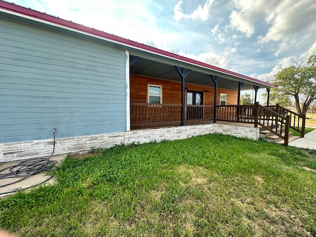 view of property exterior with a porch and a yard