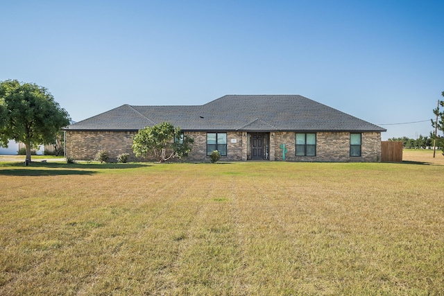 ranch-style home with a front yard