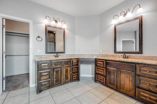 bathroom with tile patterned floors and vanity