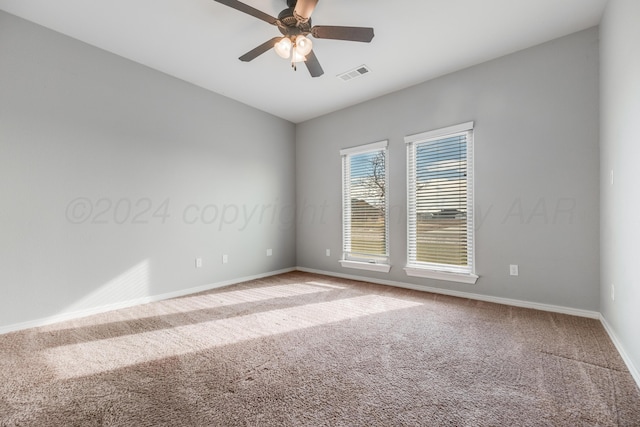 unfurnished room with carpet flooring and ceiling fan