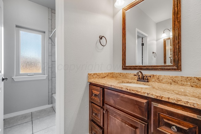 bathroom featuring tile patterned flooring, vanity, and shower / bathtub combination