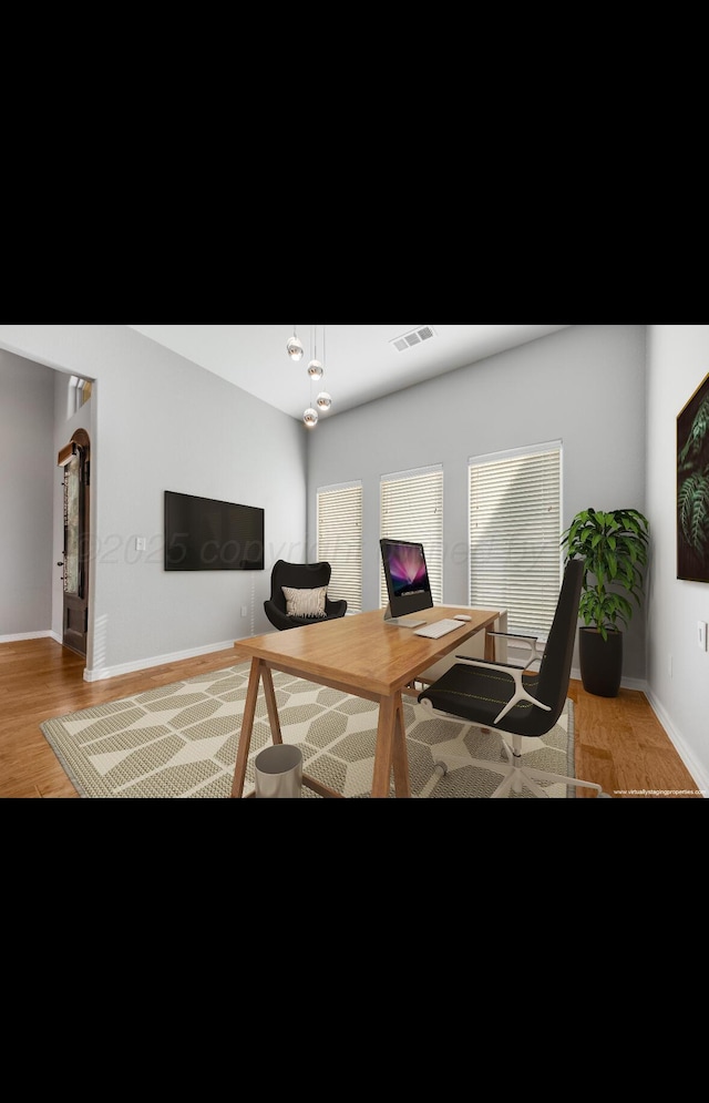 office space with light wood-type flooring