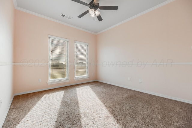 spare room featuring crown molding, carpet floors, and ceiling fan