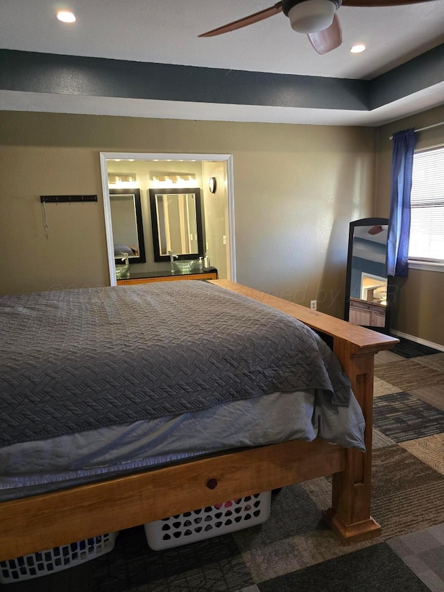 carpeted bedroom with ceiling fan