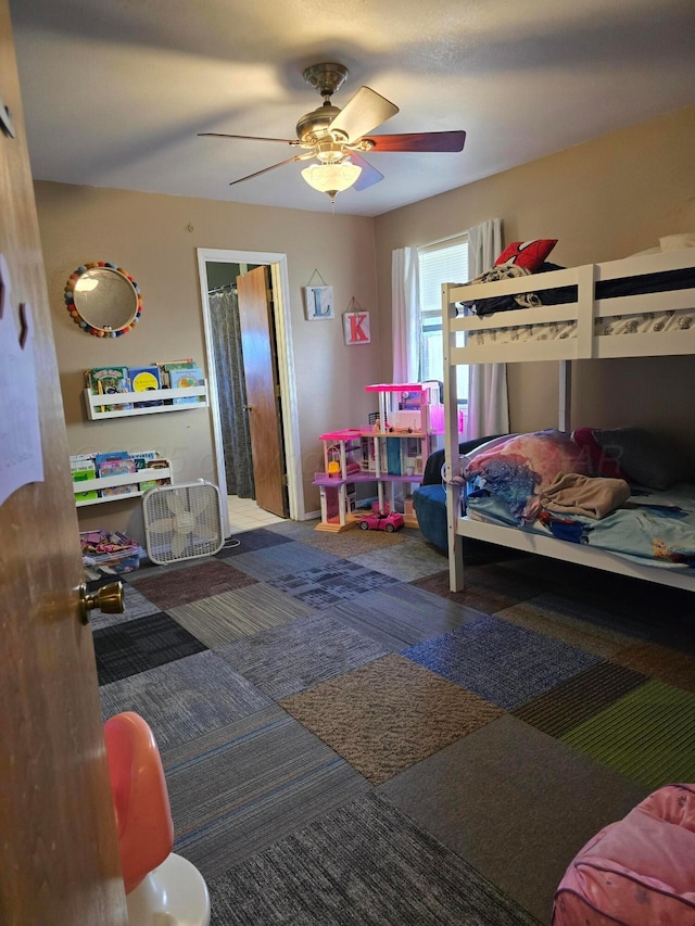 carpeted bedroom featuring ceiling fan