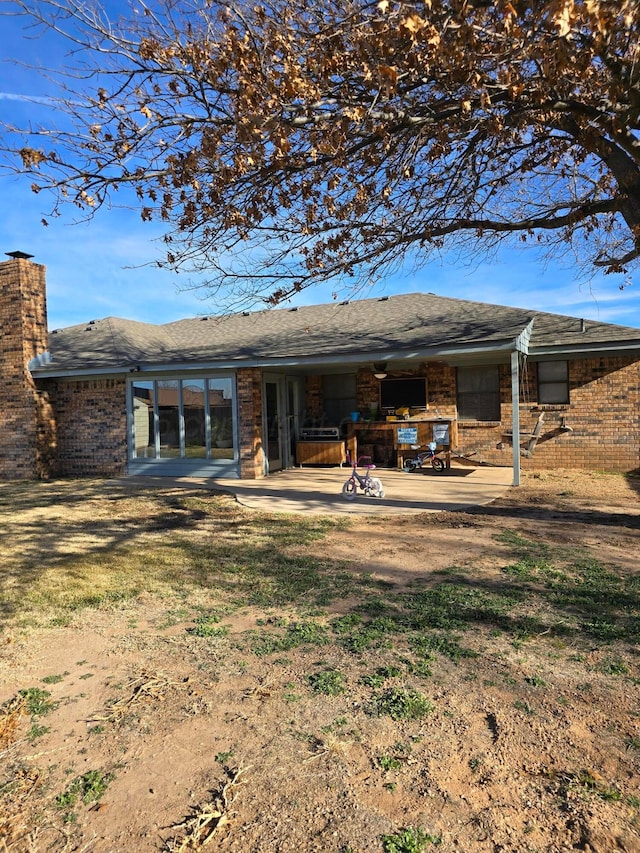 rear view of house with a patio area