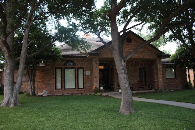 7717 Tripp Ave, Amarillo, TX 79121 - view of front of house featuring a front lawn and brick siding