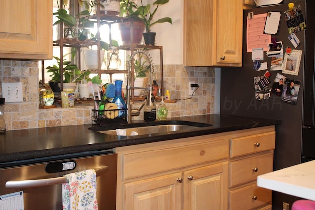 7717 Tripp Ave, Amarillo, TX 79121 - kitchen featuring dishwasher, a sink, freestanding refrigerator, and decorative backsplash