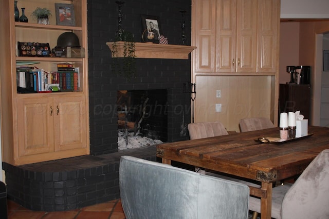 7717 Tripp Ave, Amarillo, TX 79121 - dining space featuring a fireplace and tile patterned flooring