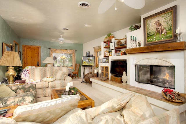 803 N Locust St, Wildorado, TX 79098 - carpeted living room with a ceiling fan and a glass covered fireplace