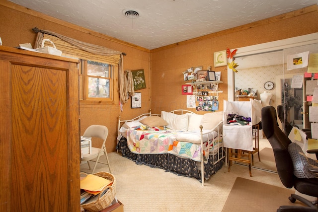 803 N Locust St, Wildorado, TX 79098 - bedroom with carpet flooring and a textured ceiling
