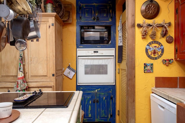 803 N Locust St, Wildorado, TX 79098 - kitchen featuring black appliances and tile counters