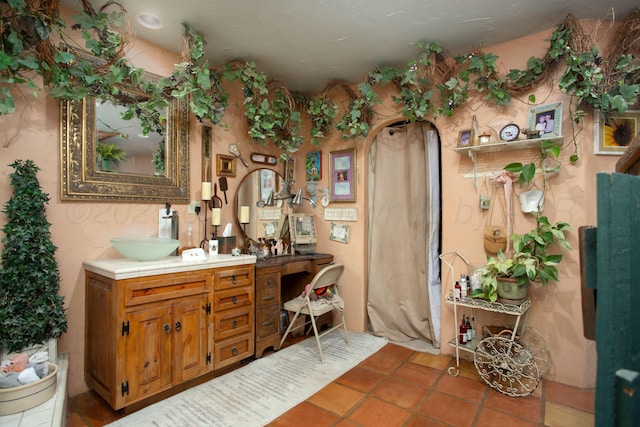 803 N Locust St, Wildorado, TX 79098 - bathroom with vanity and tile patterned flooring