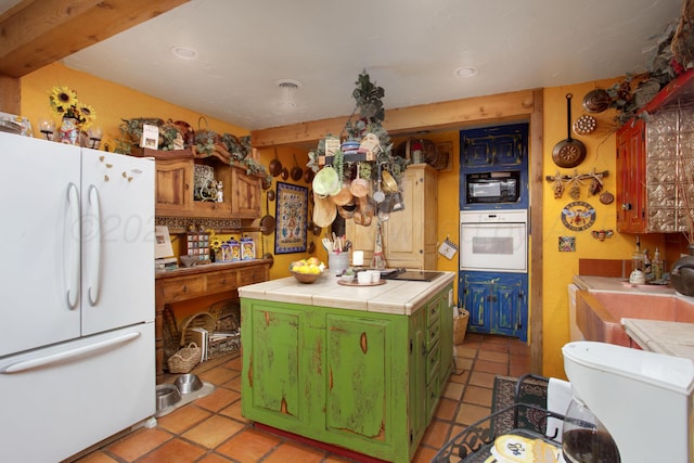 803 N Locust St, Wildorado, TX 79098 - kitchen with white appliances, tile counters, green cabinets, a sink, and light tile patterned flooring