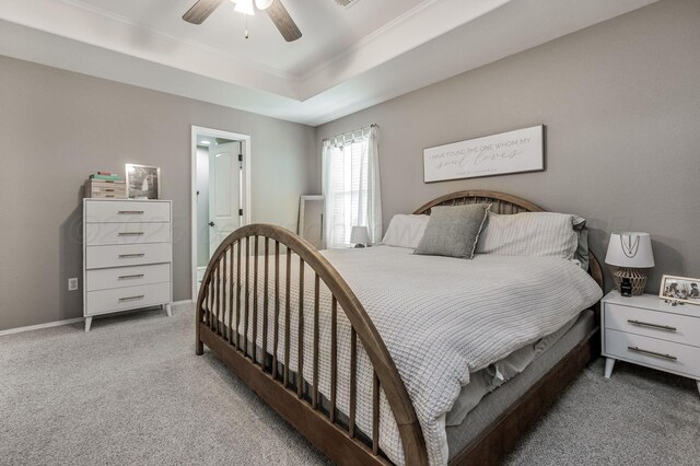 8508 Littlerock Dr, Amarillo, TX 79118 - bedroom with light carpet, a tray ceiling, ceiling fan, crown molding, and baseboards