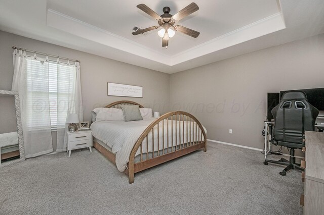 8508 Littlerock Dr, Amarillo, TX 79118 - bedroom featuring a tray ceiling, carpet flooring, an office area, a ceiling fan, and ornamental molding