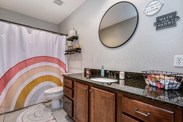 8508 Littlerock Dr, Amarillo, TX 79118 - bathroom featuring toilet, tile patterned flooring, and vanity