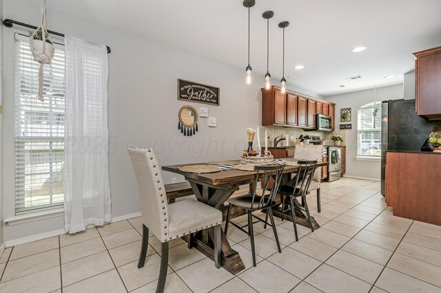 8508 Littlerock Dr, Amarillo, TX 79118 - dining room featuring light tile patterned flooring, baseboards, and recessed lighting