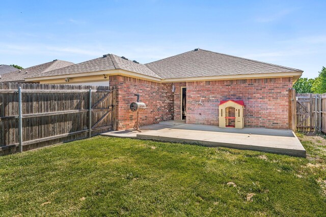 8508 Littlerock Dr, Amarillo, TX 79118 - back of property with a gate, brick siding, a patio area, and roof with shingles