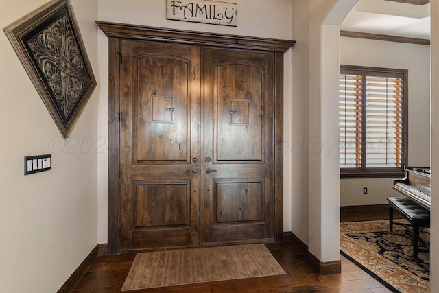 2501 Mackenzie Trl, Amarillo, TX 79124 - foyer featuring dark wood finished floors, baseboards, and arched walkways