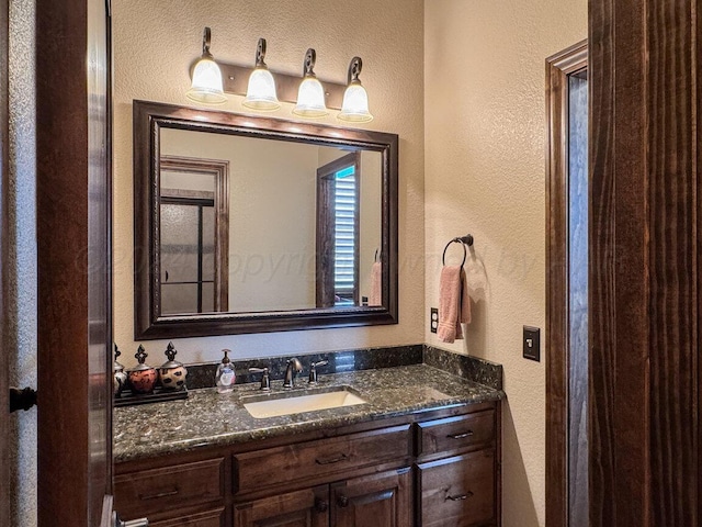 2501 Mackenzie Trl, Amarillo, TX 79124 - bathroom featuring vanity and a textured wall