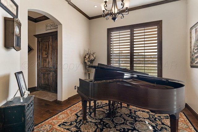 2501 Mackenzie Trl, Amarillo, TX 79124 - living area featuring ornamental molding, hardwood / wood-style floors, arched walkways, an inviting chandelier, and baseboards