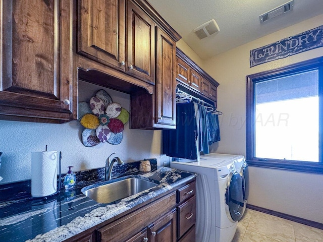 2501 Mackenzie Trl, Amarillo, TX 79124 - laundry room with independent washer and dryer, cabinet space, visible vents, and a sink