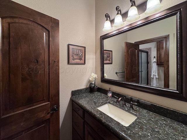 2501 Mackenzie Trl, Amarillo, TX 79124 - bathroom featuring vanity and a textured wall