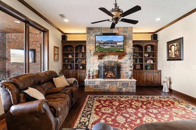2501 Mackenzie Trl, Amarillo, TX 79124 - living room featuring a stone fireplace, a ceiling fan, visible vents, and hardwood / wood-style floors