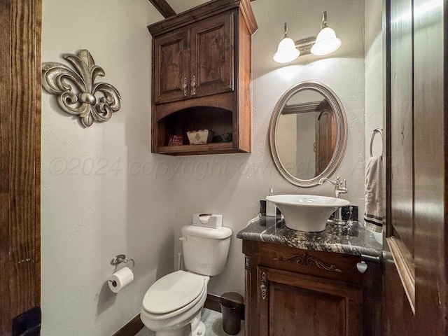 2501 Mackenzie Trl, Amarillo, TX 79124 - bathroom featuring toilet, vanity, and baseboards