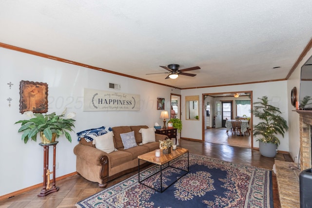 2041 S Travis St, Amarillo, TX 79109 - living room with ceiling fan, ornamental molding, a textured ceiling, and a brick fireplace