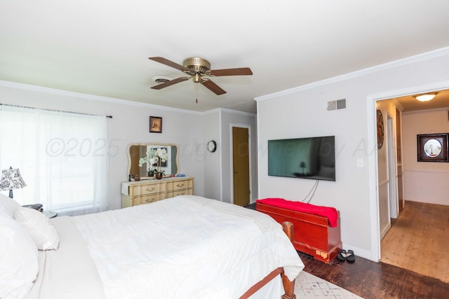 2041 S Travis St, Amarillo, TX 79109 - bedroom with dark wood finished floors, crown molding, and a ceiling fan