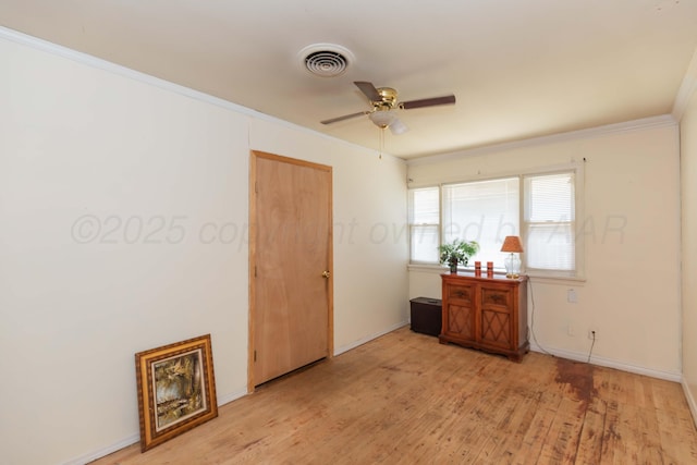 2041 S Travis St, Amarillo, TX 79109 - spare room featuring a ceiling fan, ornamental molding, and wood finished floors