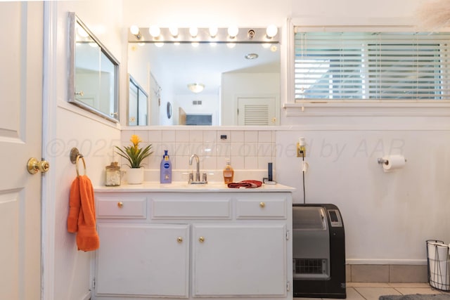 2041 S Travis St, Amarillo, TX 79109 - bathroom featuring backsplash, vanity, tile patterned floors, and heating unit