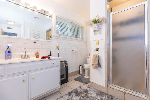 2041 S Travis St, Amarillo, TX 79109 - full bath featuring vanity, tile patterned floors, and a shower stall