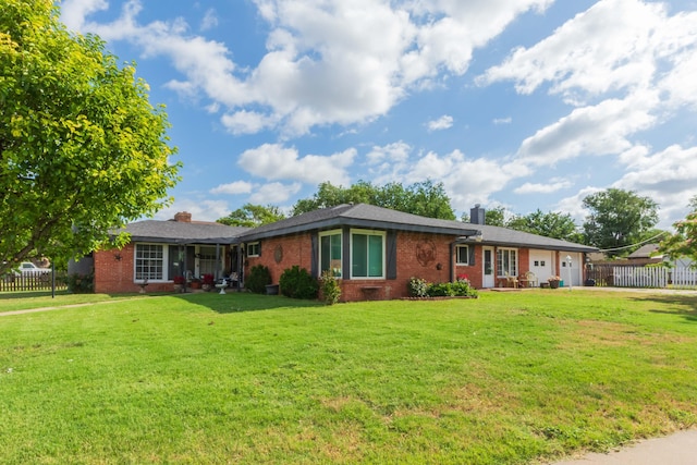 2041 S Travis St, Amarillo, TX 79109 - ranch-style home with a chimney, brick siding, and a garage
