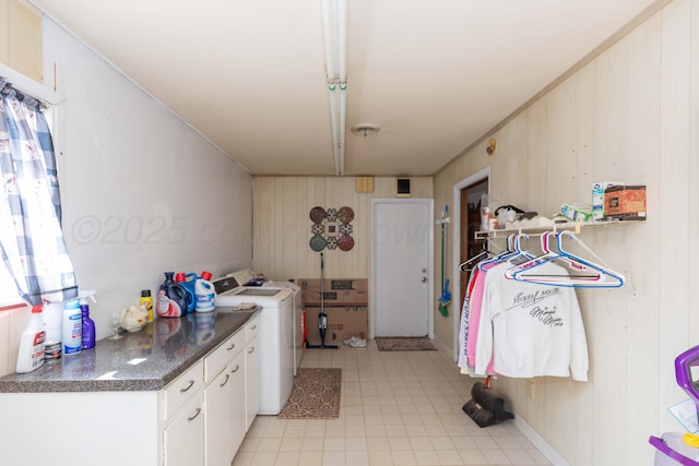 2041 S Travis St, Amarillo, TX 79109 - laundry room with wooden walls, light tile patterned flooring, and plenty of natural light