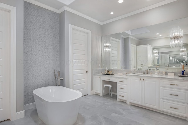 bathroom with vanity, a bathing tub, and ornamental molding