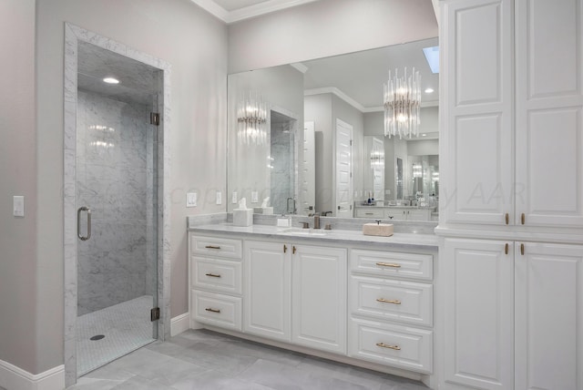 bathroom with vanity, an enclosed shower, and crown molding