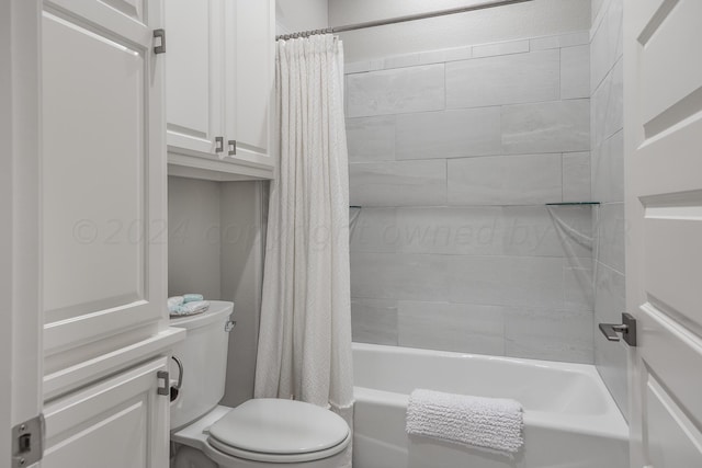 bathroom featuring shower / bath combo and toilet