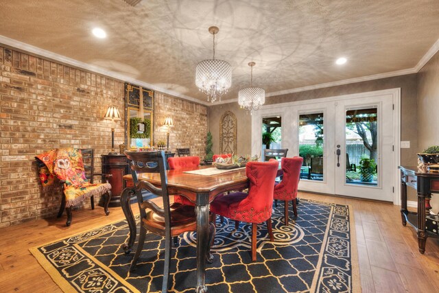 5200 Kingswood Cir, Amarillo, TX 79109 - dining area with a chandelier, hardwood / wood-style floors, recessed lighting, ornamental molding, and french doors