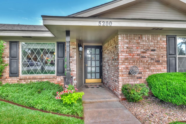 5200 Kingswood Cir, Amarillo, TX 79109 - doorway to property featuring brick siding
