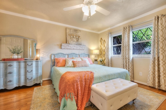 5200 Kingswood Cir, Amarillo, TX 79109 - bedroom featuring wood finished floors, ornamental molding, and ceiling fan