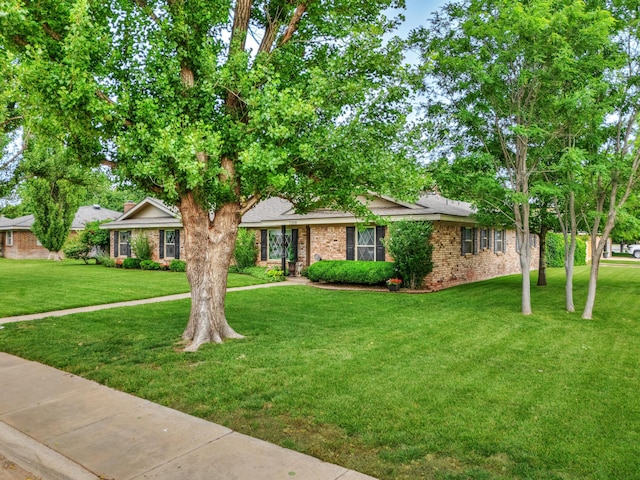 5200 Kingswood Cir, Amarillo, TX 79109 - single story home with brick siding and a front lawn